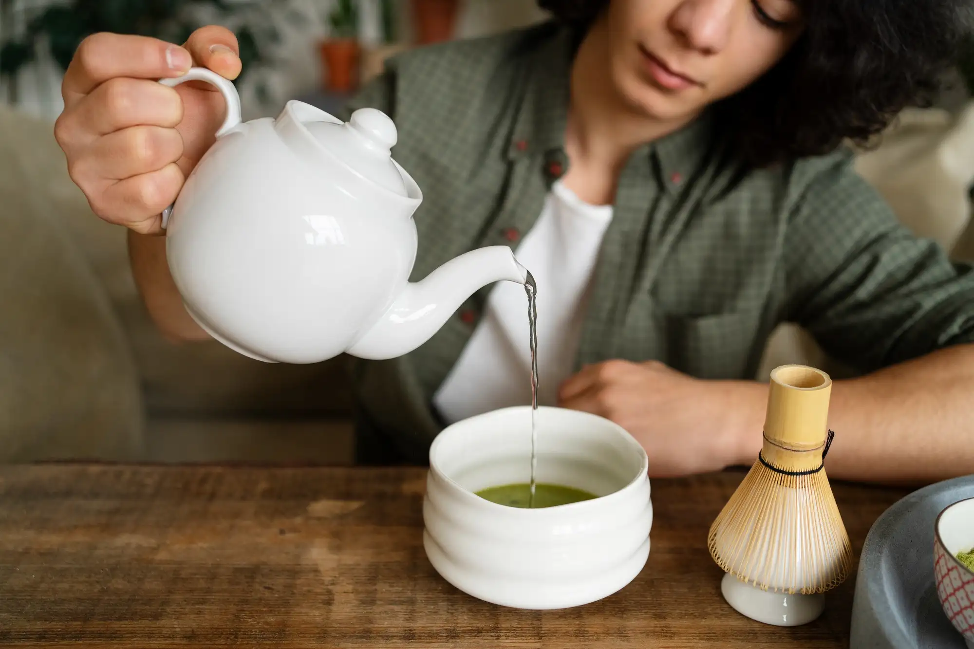 man-pouring-green-tea