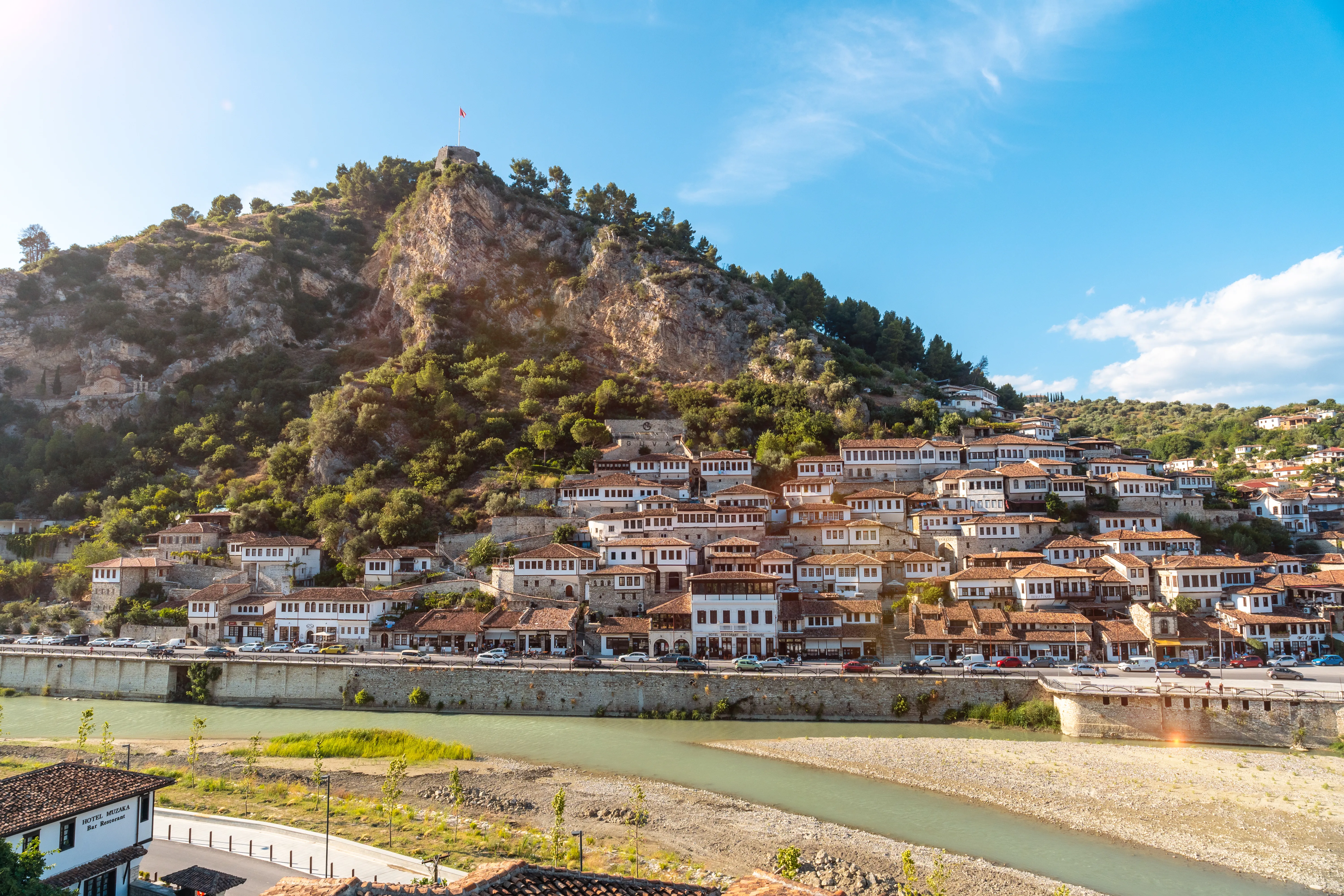 A wide-angle, eye-level shot of the historic Mangalem quarter in Berat, Albania