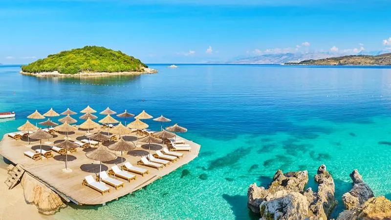 A wide-angle, elevated shot of Ksamil Beach in Albania