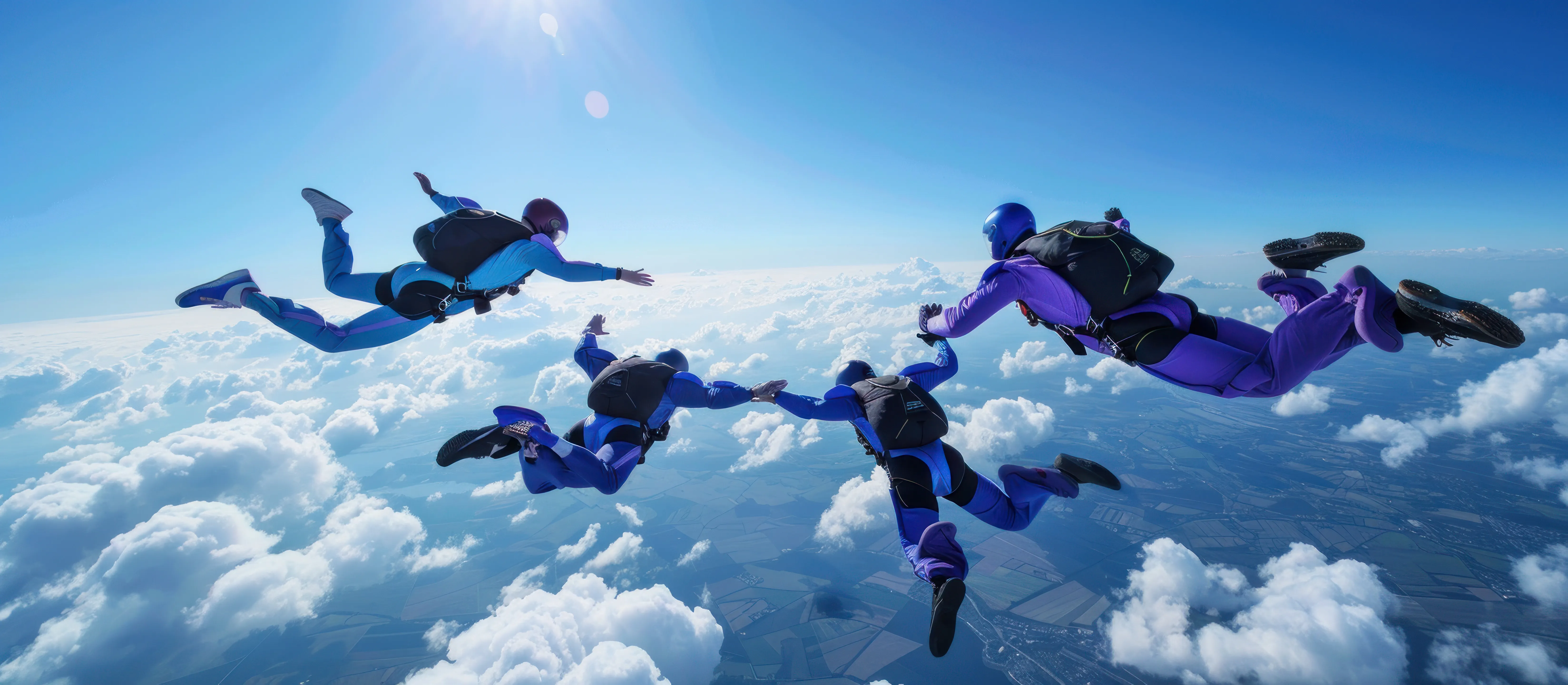 Group skydiving above the clouds during a freefall adventure in New Zealand