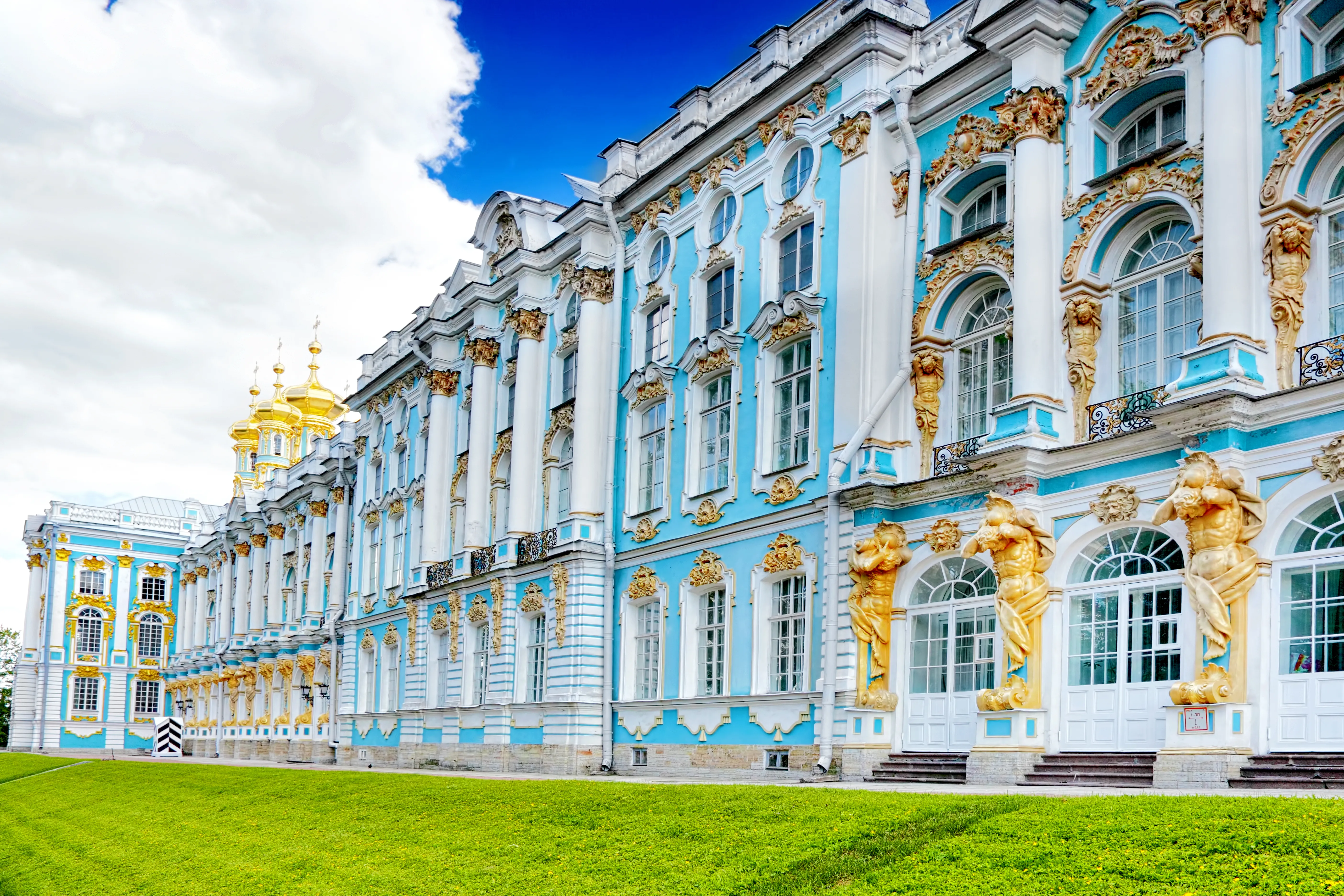 An architectural photograph shows the Catherine Palace in Tsarskoye Selo, Pushkin, near Saint Petersburg, Russia.