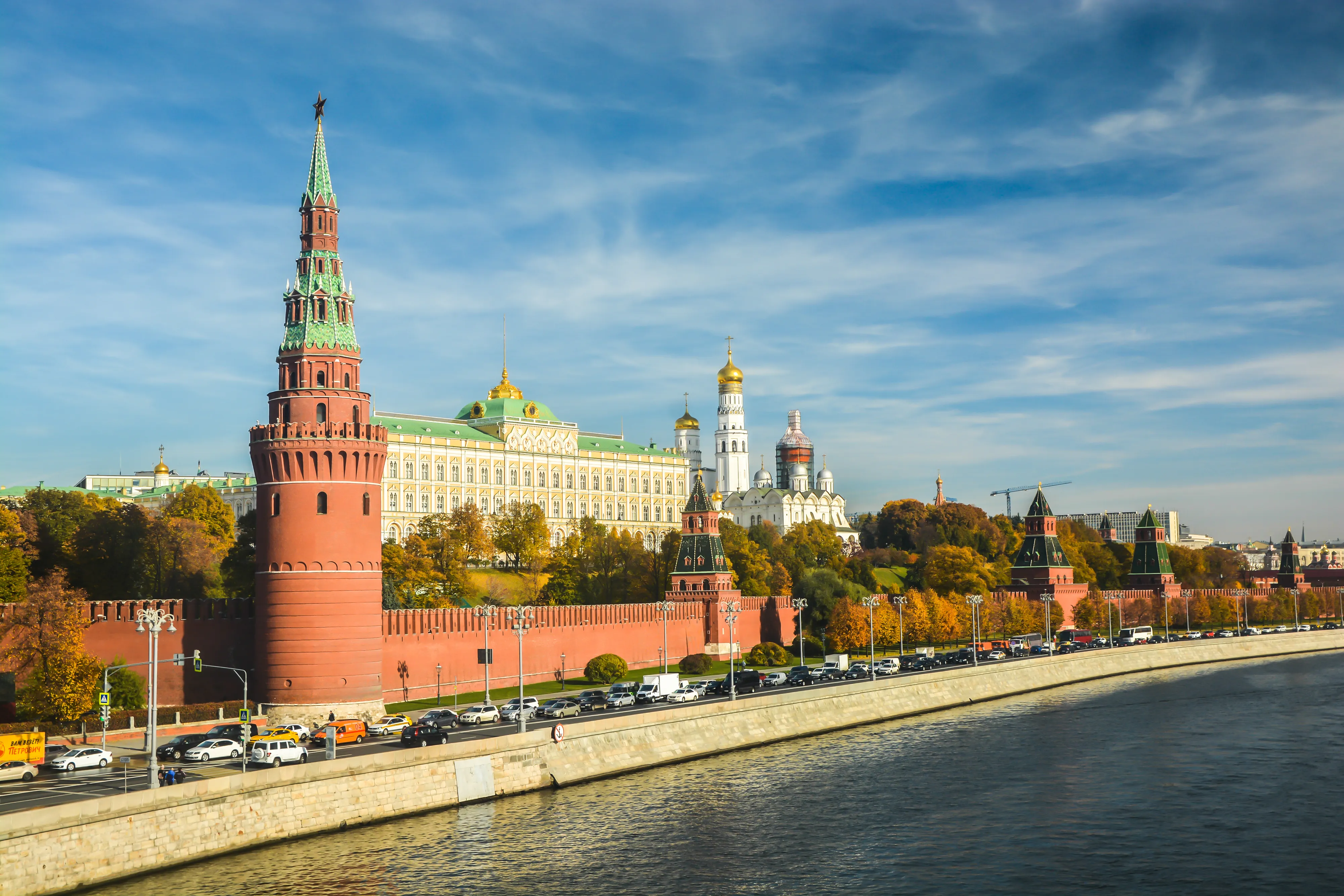 a scenic view of the Moscow Kremlin complex, shot from across the Moskva River