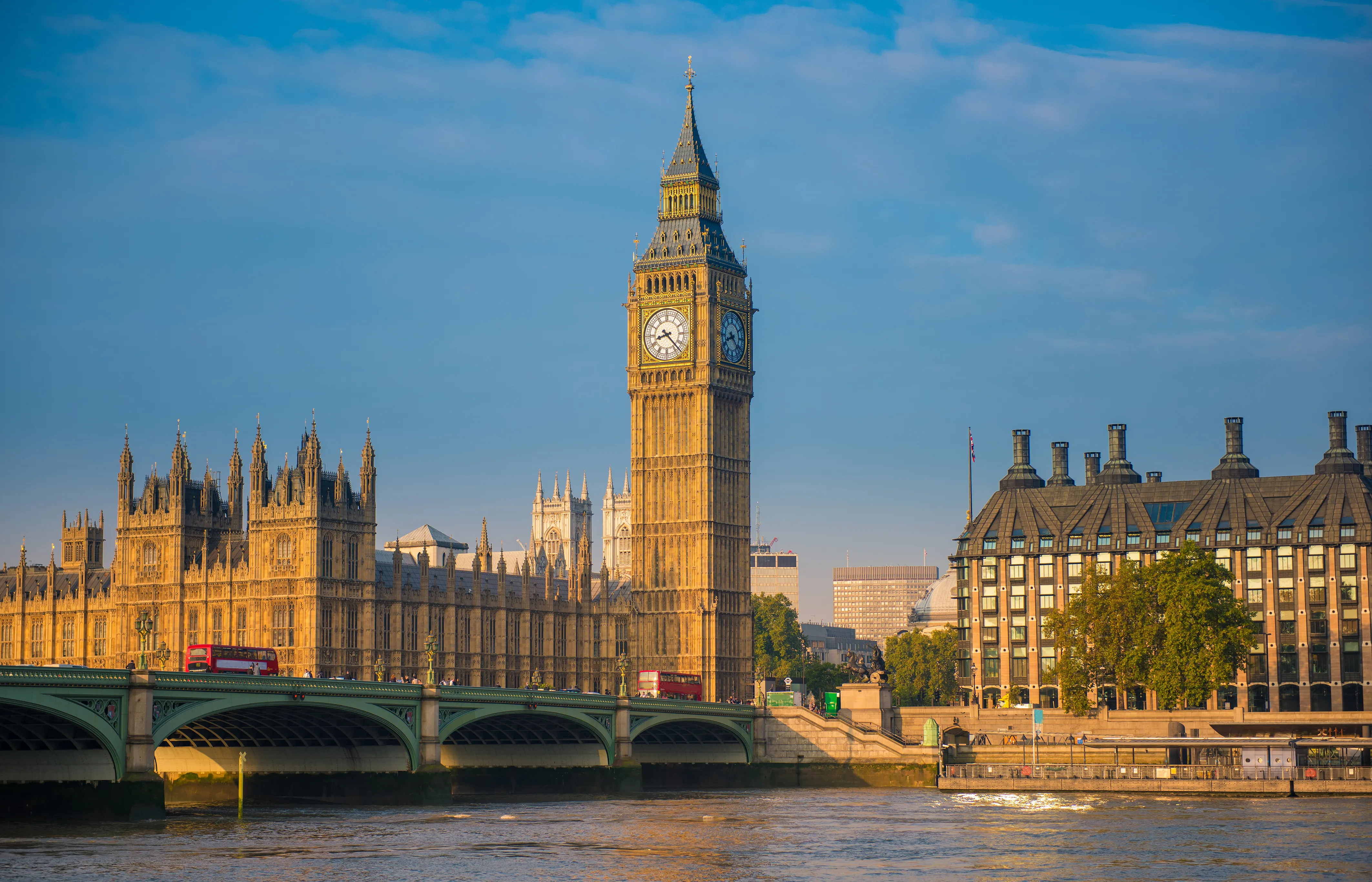An architectural and cityscape photograph shows the Palace of Westminster and the Big Ben clock tower (Elizabeth Tower) from Westminster Bridge in London, United Kingdom