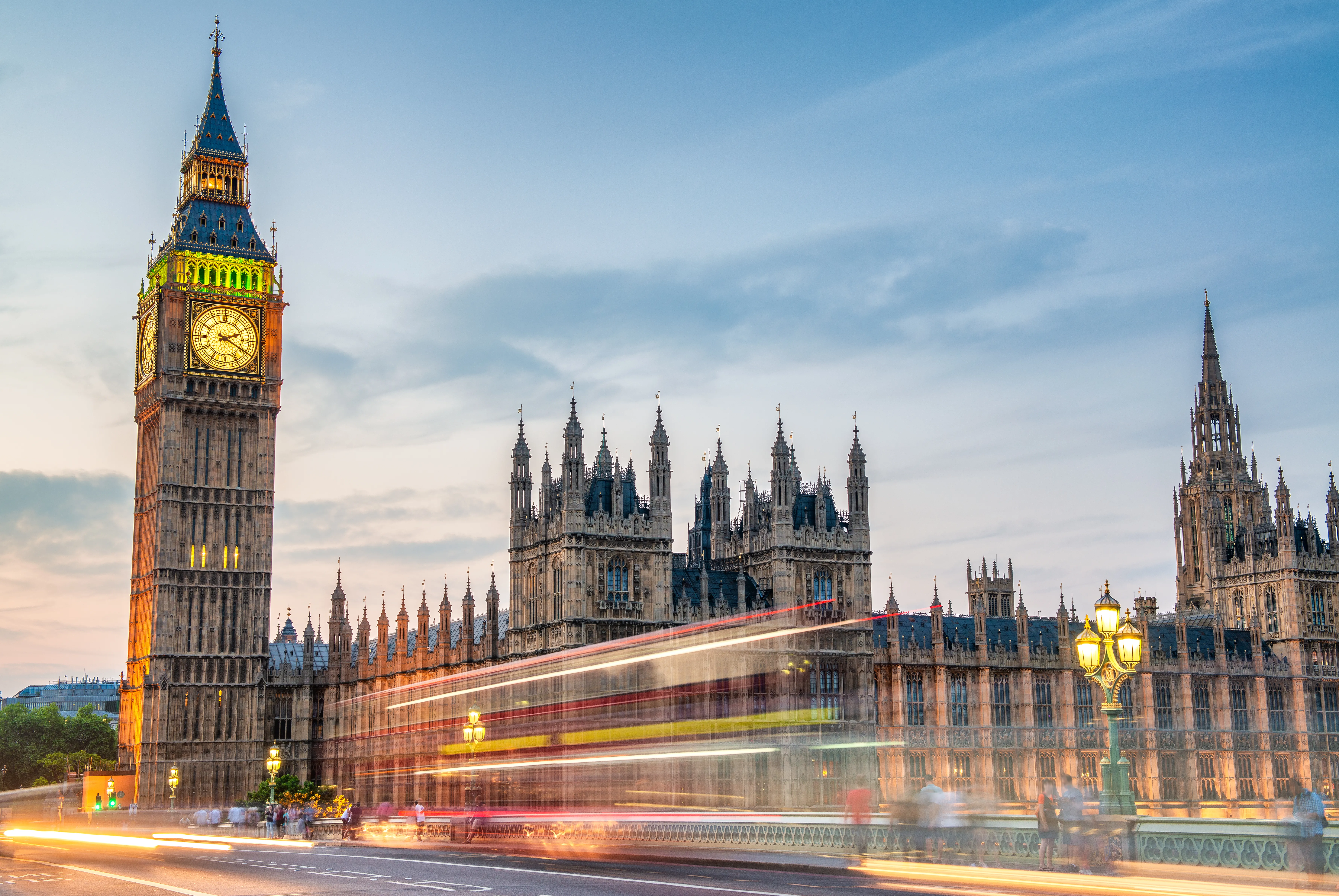An architectural and cityscape photograph shows the Palace of Westminster and the Big Ben clock tower (Elizabeth Tower) from Westminster Bridge in London, United Kingdom.