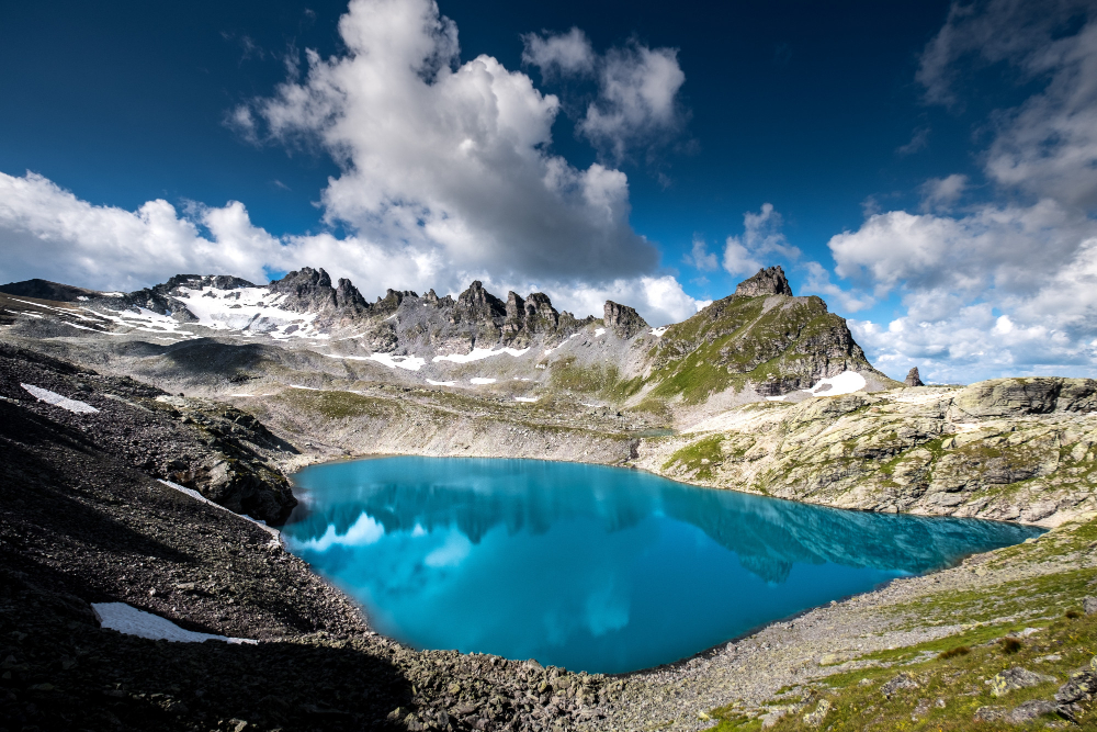 body-of-water-surrounded-by-rocky-mountains