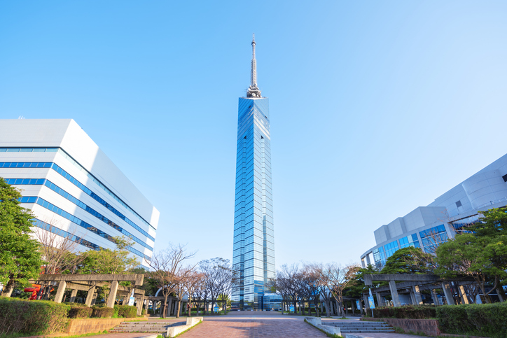Fukuoka Tower stands tall in the middle of a park