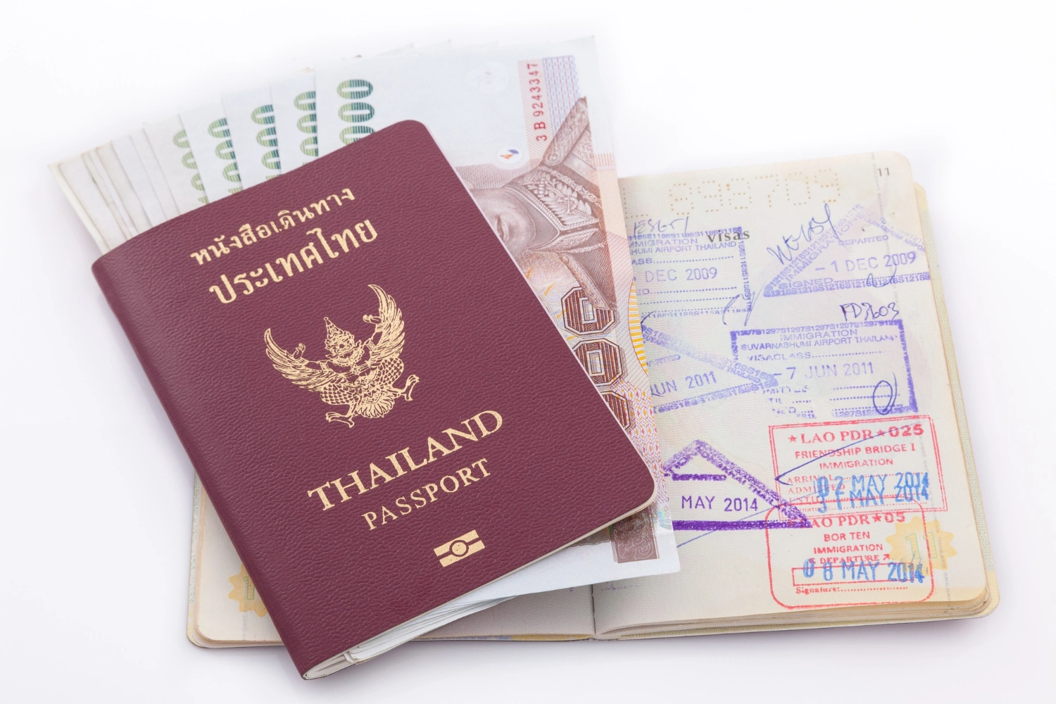 thai-passport-with-border-stamp-with-money-in-it