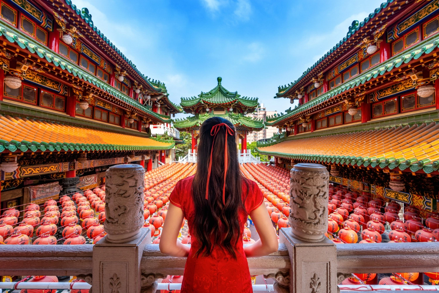 Asian-woman-wearing-red-dress-in-front-of-sanfeng-temple-kaohsiung